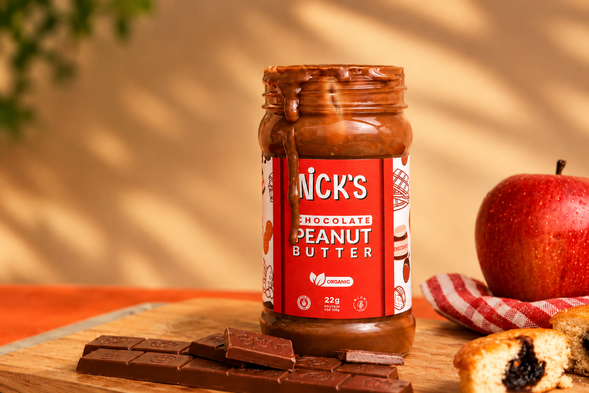 Close-up of NICK'S chocolate peanut butter dripping over the rim of the jar